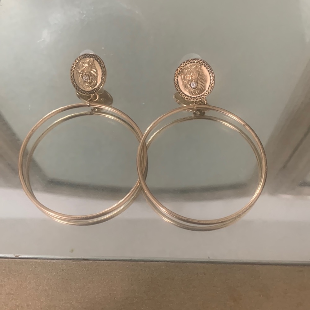 Pre-loved gold hoops with lion emblem!